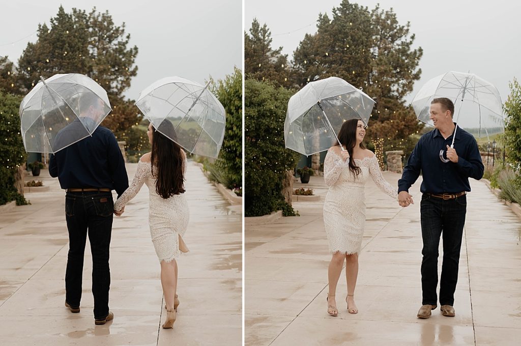 couple holding umbrellas walking in the rain