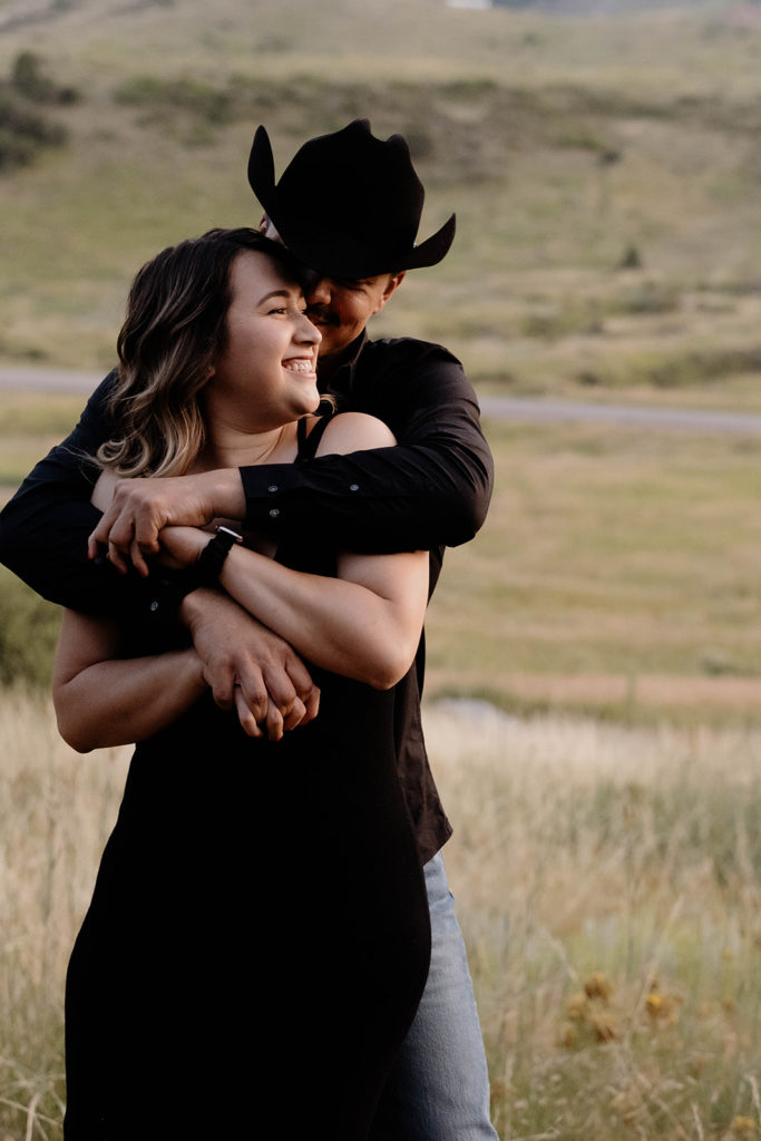 couple hugging in colorado at engagement session