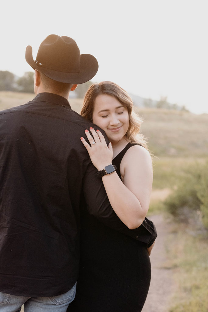 engagement photos in colorado showing off engagement rings