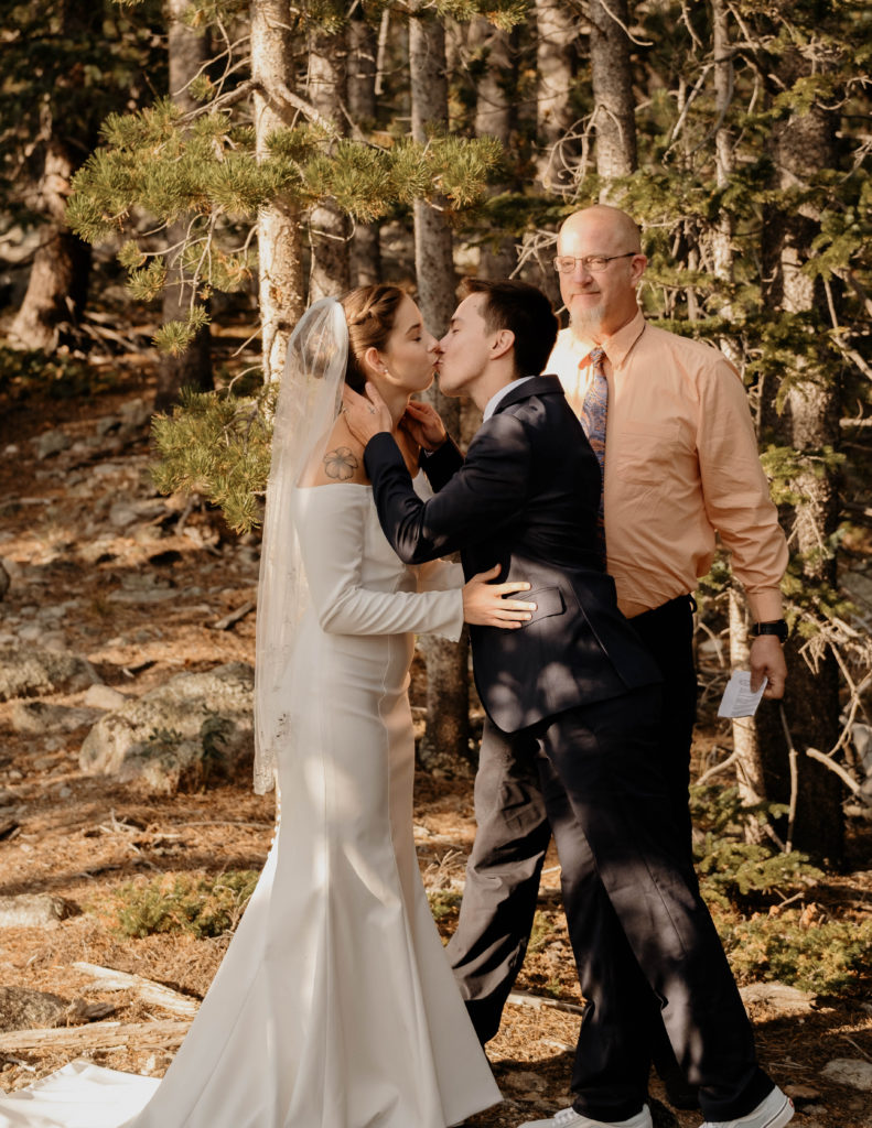 bride and groom kissing on their first look at elopement