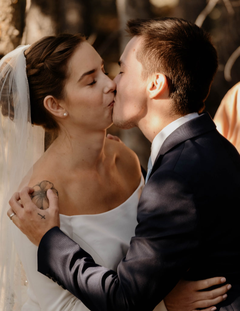 bride and groom first kiss at elopement